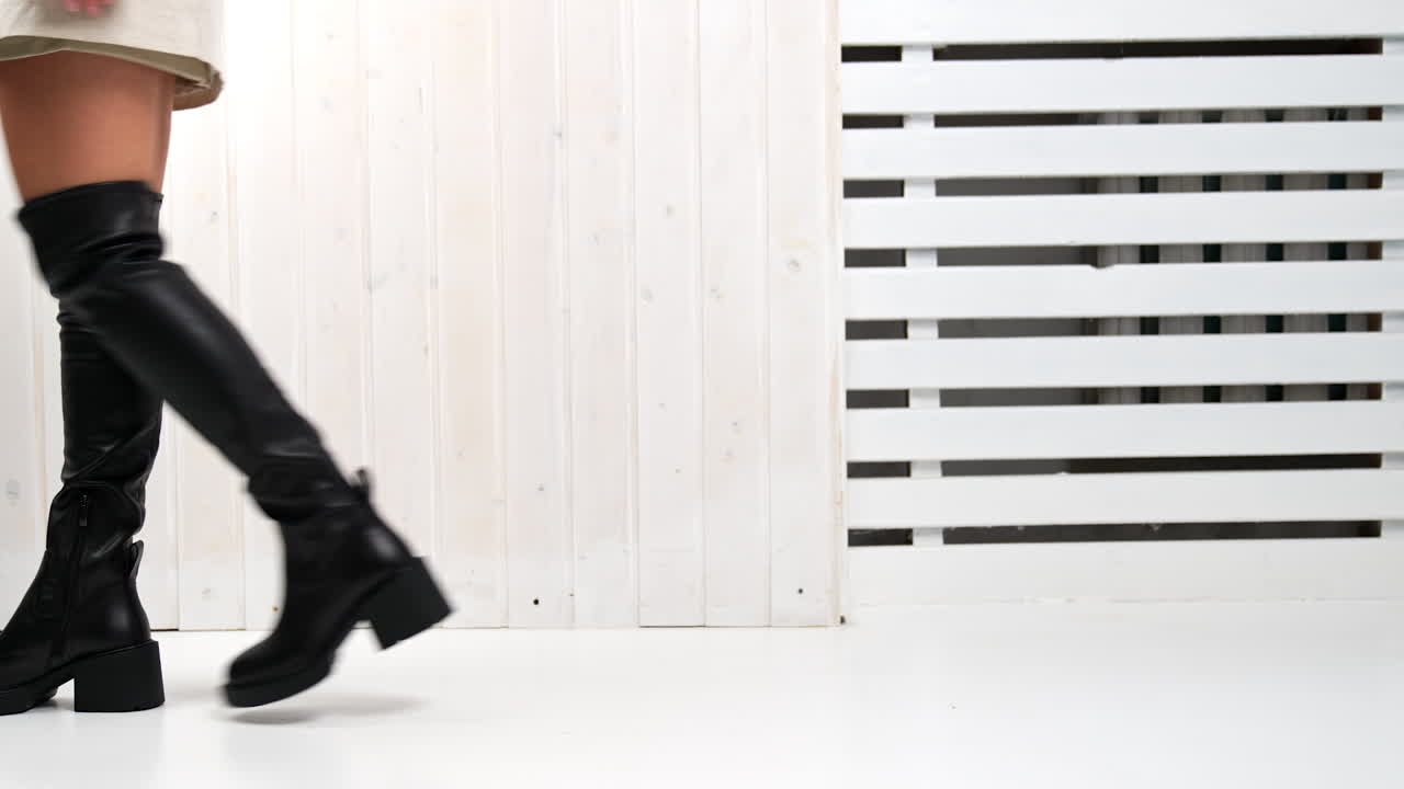 Woman wearing platform over-the-knee boots