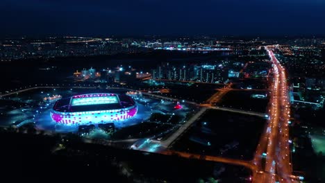 night aerial view of a freeway intersection and football stadium spartak moscow otkritie arena