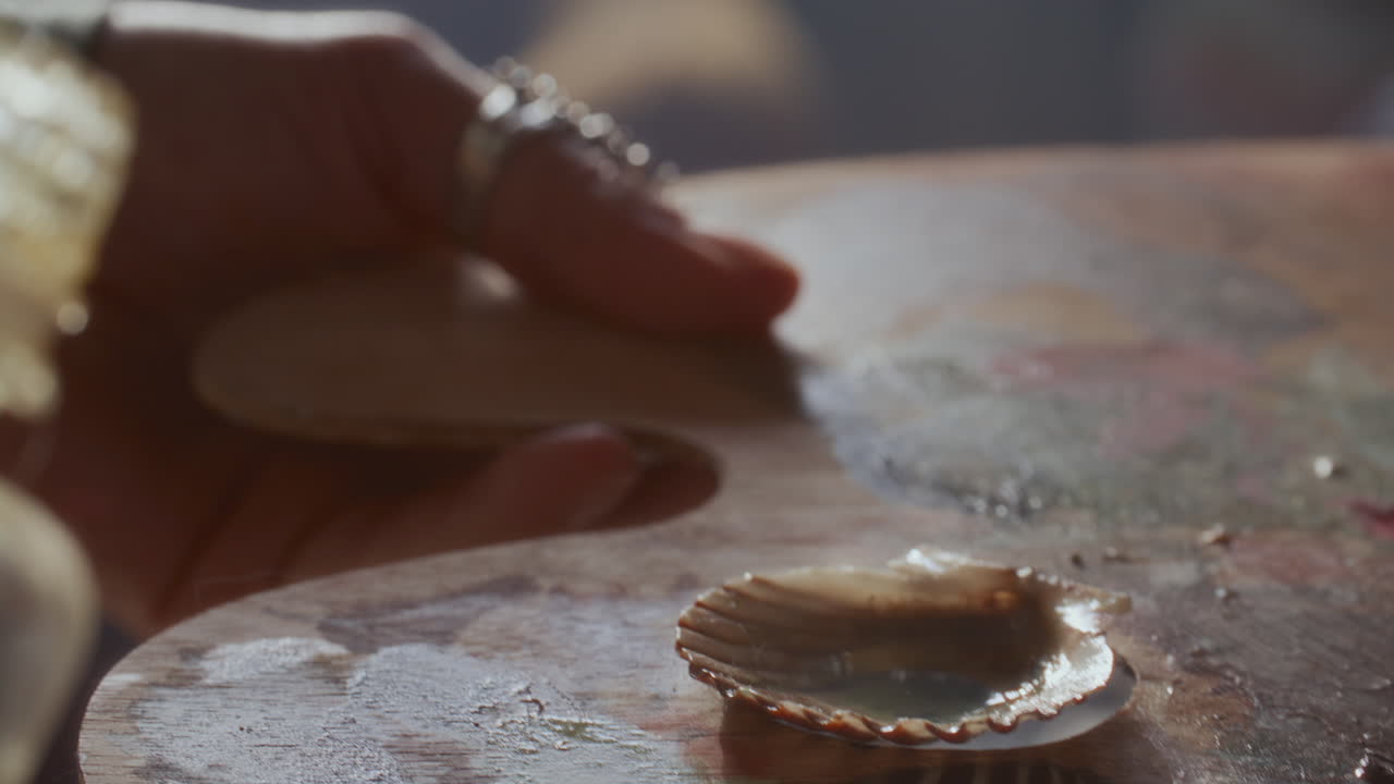 Close Up of Pouring Painting Medium into Shell on Palette