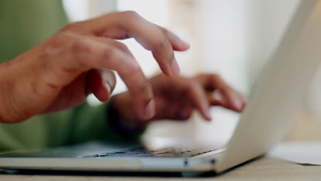 Hands-of-person,-laptop-and-typing-in-home