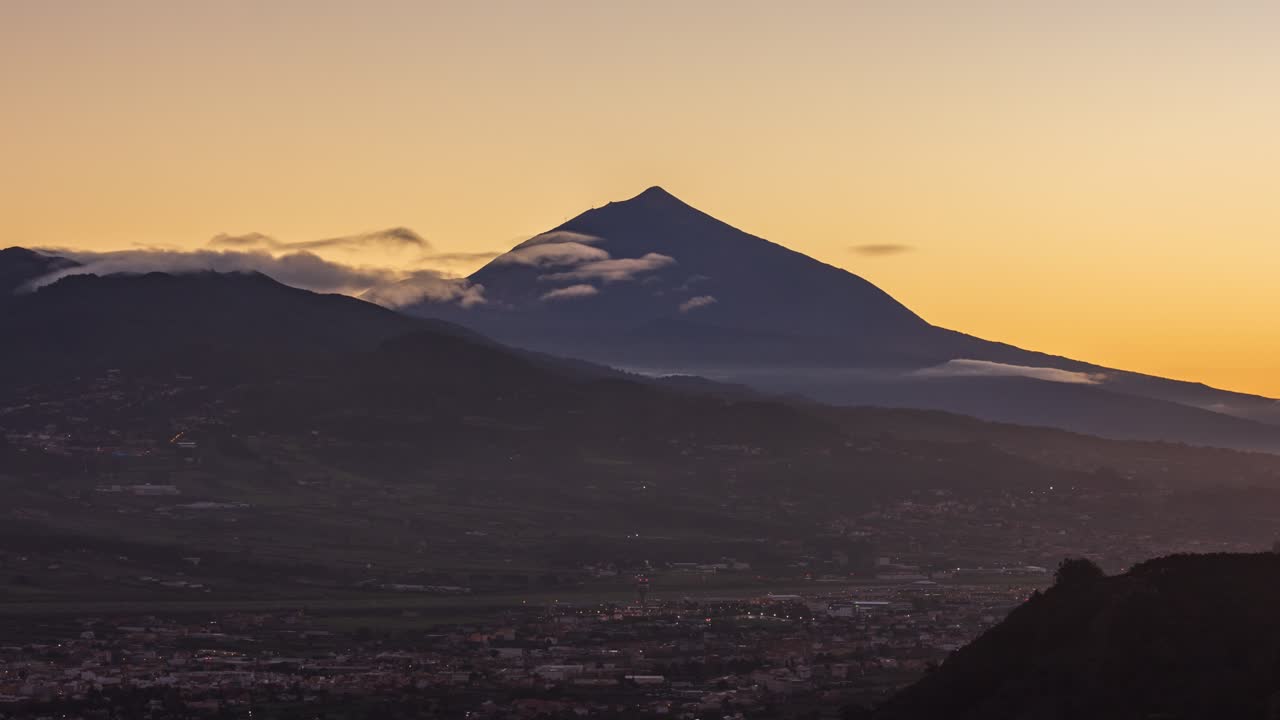 Sunset over Teide Volcano and La Laguna on Tenerife. Video with camera motion