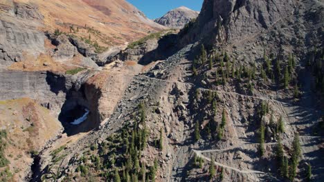 close up drone shot scaling up the mountainside of black bear pass in telluride