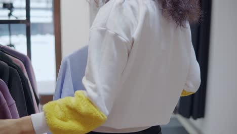 woman shopping for clothes in a store