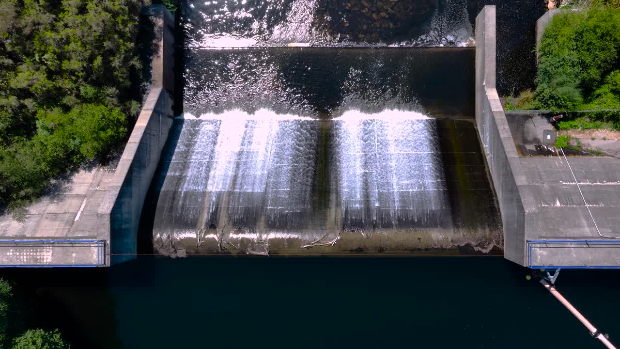 Topdown View Of Concrete Dam In River Lerez Through Campo Lameiro In Galicia, Spain. Aerial Descending Shot