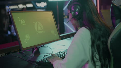 Side-View-Of-An-Excited-Female-Gamer-Playing-Virtual-Video-Games-On-Professional-Powerful-Computer-With-Green-Screen-Display