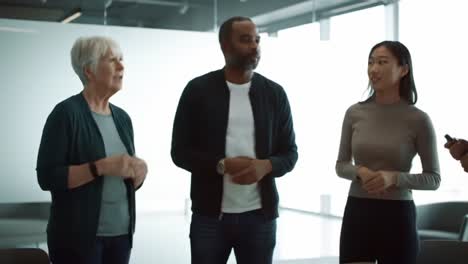 a diverse group engaged in discussion: collaborative dialogue among team members in a modern office environment
