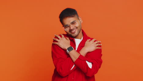indian man spread hands and give hug to you pleasant expression love feelings proud satisfied