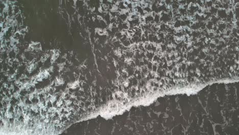 Aerial-top-shot-of-waves-in-slow-motion-