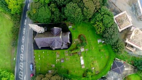overhead spinning drone shot of the holy trinity church of ireland and neighborhood in londonderry, ireland