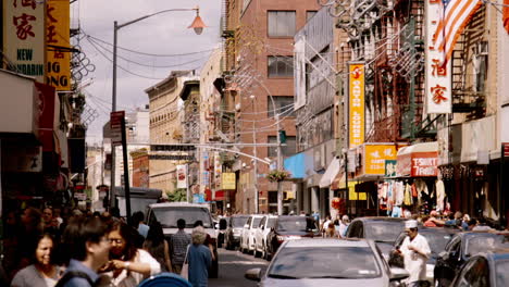 busy street scene in a city with asian businesses