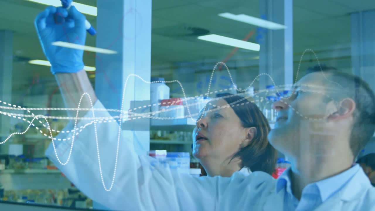 Woman raising blue marker writing on glass panel in lab causing animated waves while man analyzing