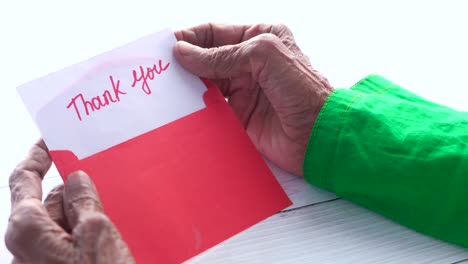 thank you note in hands