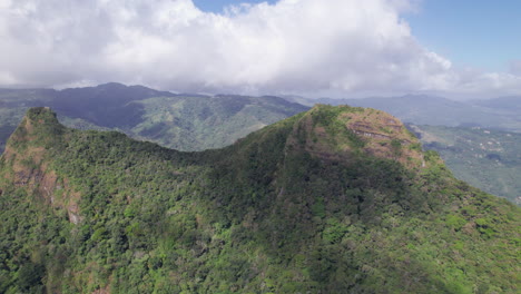 lush san carlos mountain ranges under a partly cloudy sky, aerial view