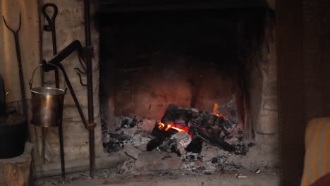 a warm fire burning in a fireplace