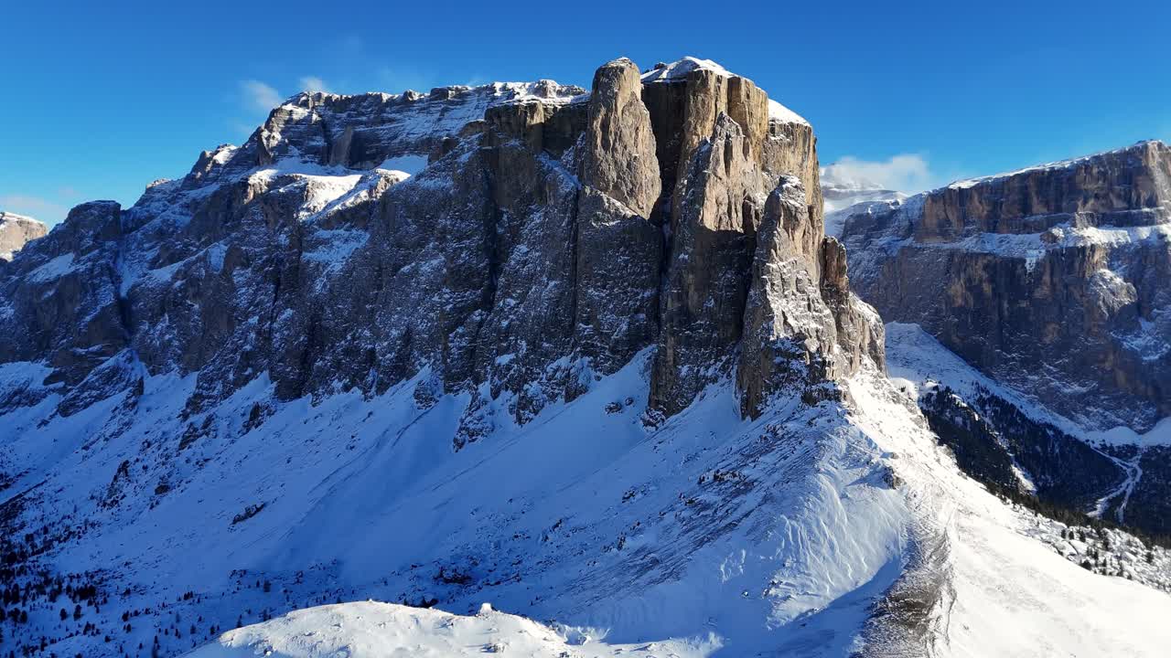 Reveal of Dolomiti rock formation during the winter (drone footage)
