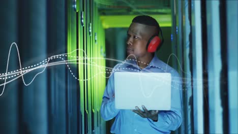 animation of data processing over african american male it engineer and computer servers