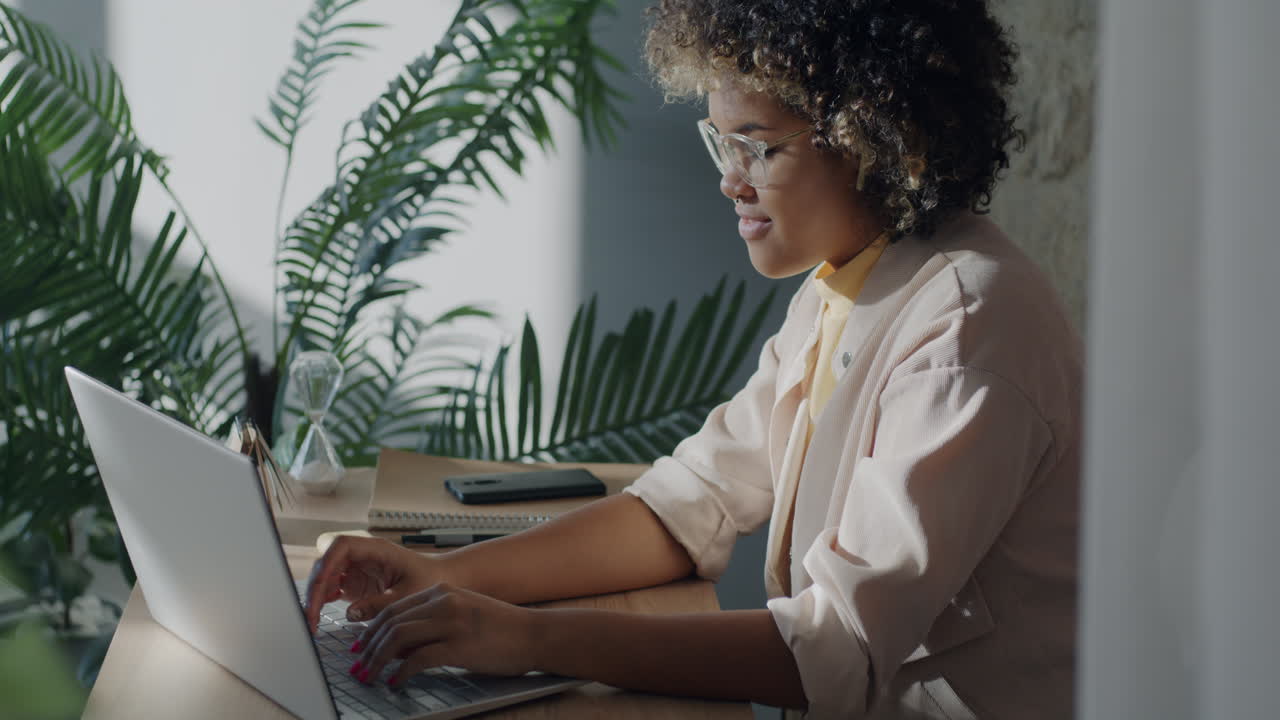 Young woman working from home on a laptop