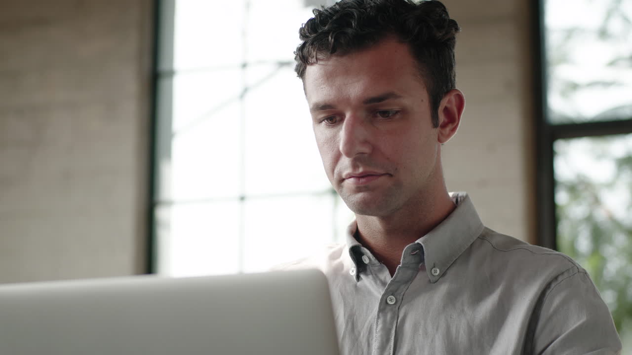Man sleeping at laptop