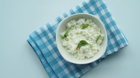 cottage cheese in a bowl with parsley