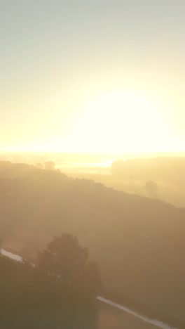misty sunrise over a valley