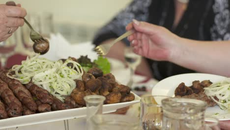 dinner table served with lula kebabs and fresh vegetables