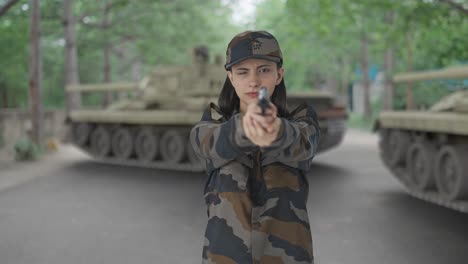 indian woman army officer aiming the handgun