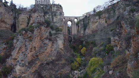 retreating aerial reveals guadalevin river gorge splitting ronda spain