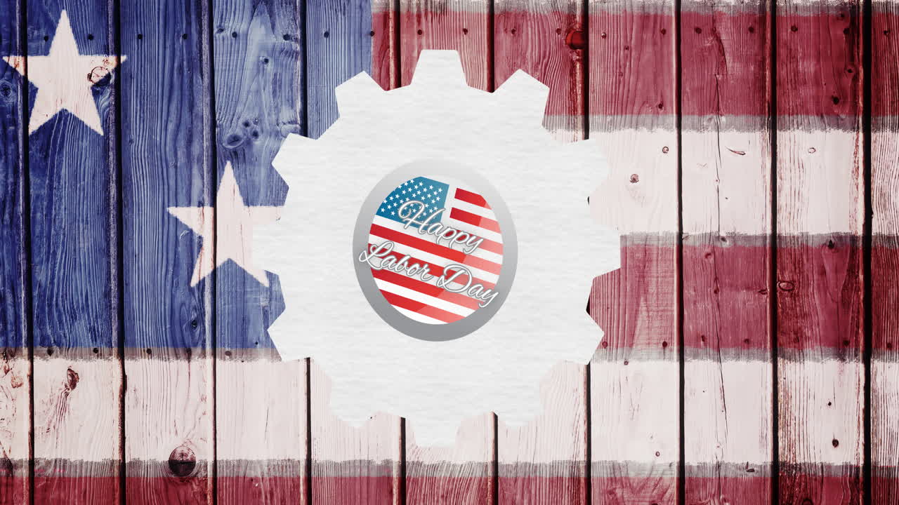 Animazione di testo "Buona Festa del Lavoro" su ingranaggio e bandiera americana