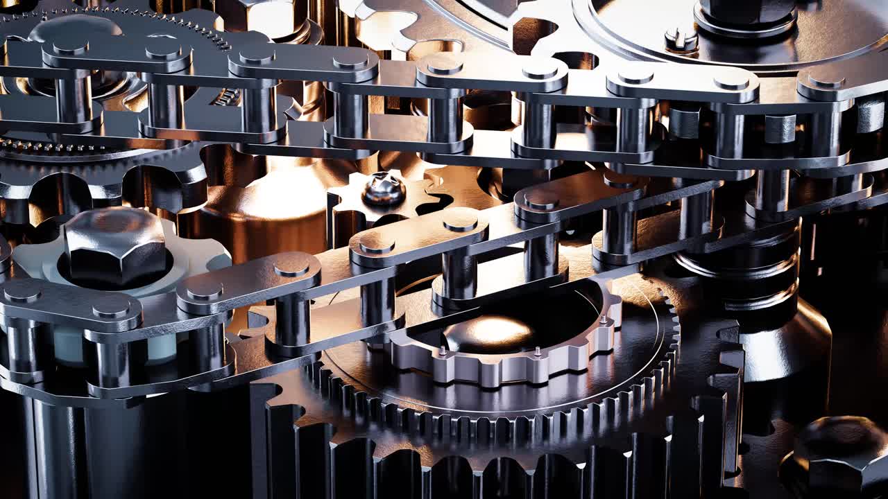 Složitý mechanický systém s rotujícími ozubenými koly a řetězy
