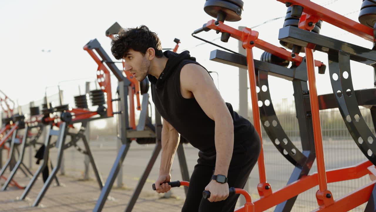 Man Doing Push-ups on Outdoor Gym Equipment