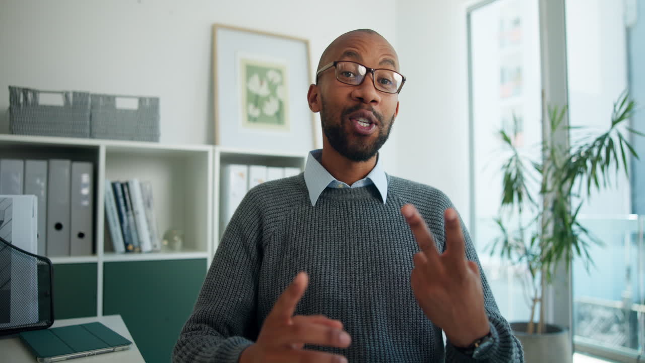 African American Man Speaking and Gesturing During Video Call