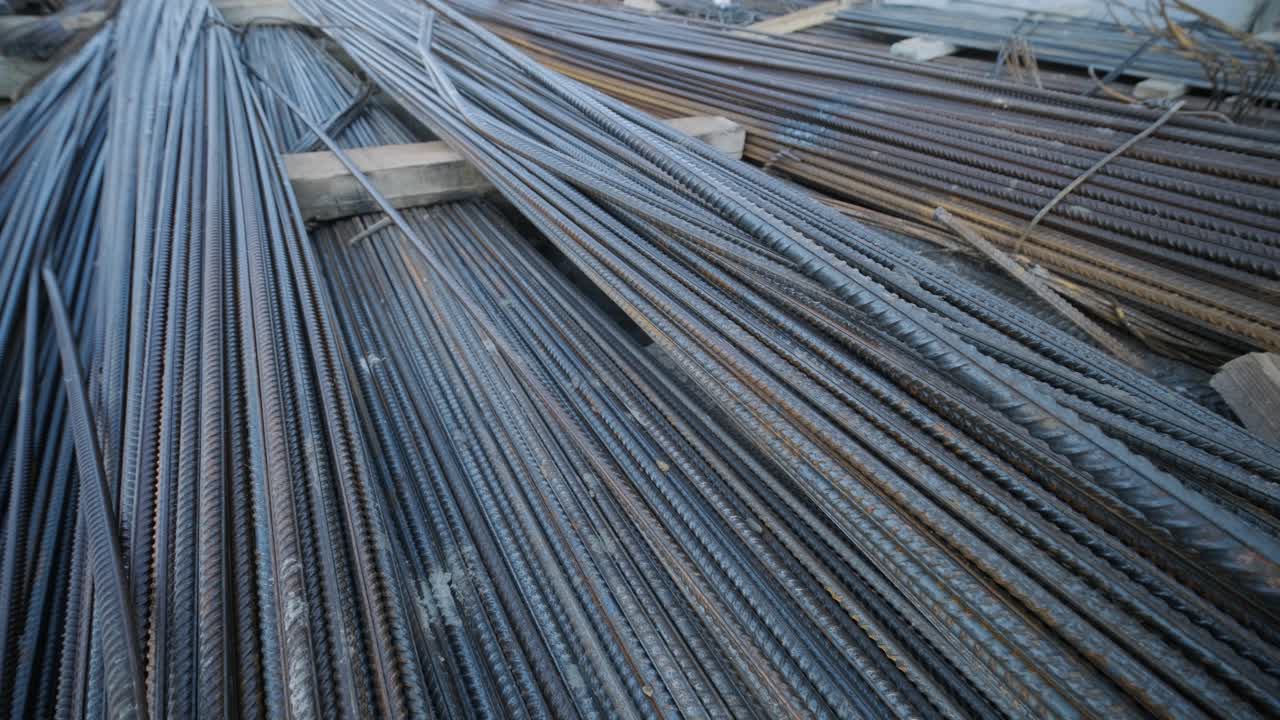 A large bundle of iron construction fittings in close-up