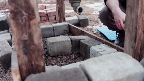 cropped view of a person building a diy hot tub