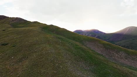 rock and vegetation covered mountain range