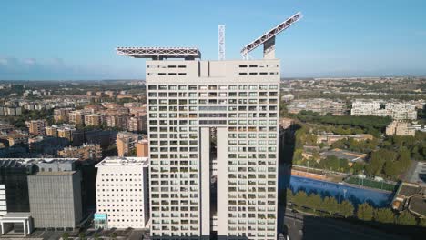 Drone-Ascends-Above-Eurosky-Tower-in-Rome,-Italy