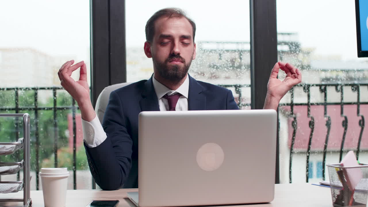 Businessman Meditating at Desk