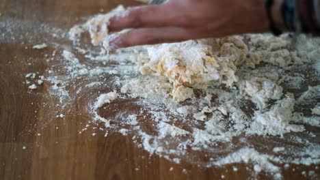 chef kneading flour and egg dough for the creation of handmade pasta