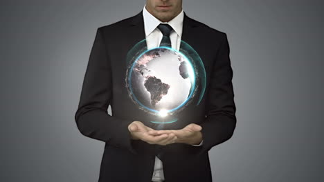 Businessman-holding-digital-generated-globe