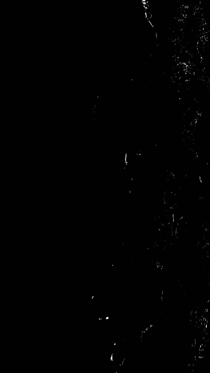 Abstrakt hvid grunge-tekstur overlay på sort baggrund.