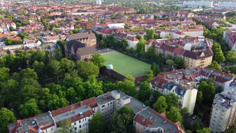 german school with large soccer field in the city beautiful aerial view flightpanorama overview drone footage of berlin friedenau summer 2022 cinematic view from above tourist guide by philipp marnitz