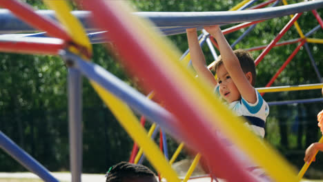 Schoolkids-playing-on-monkey-bar-in-playground