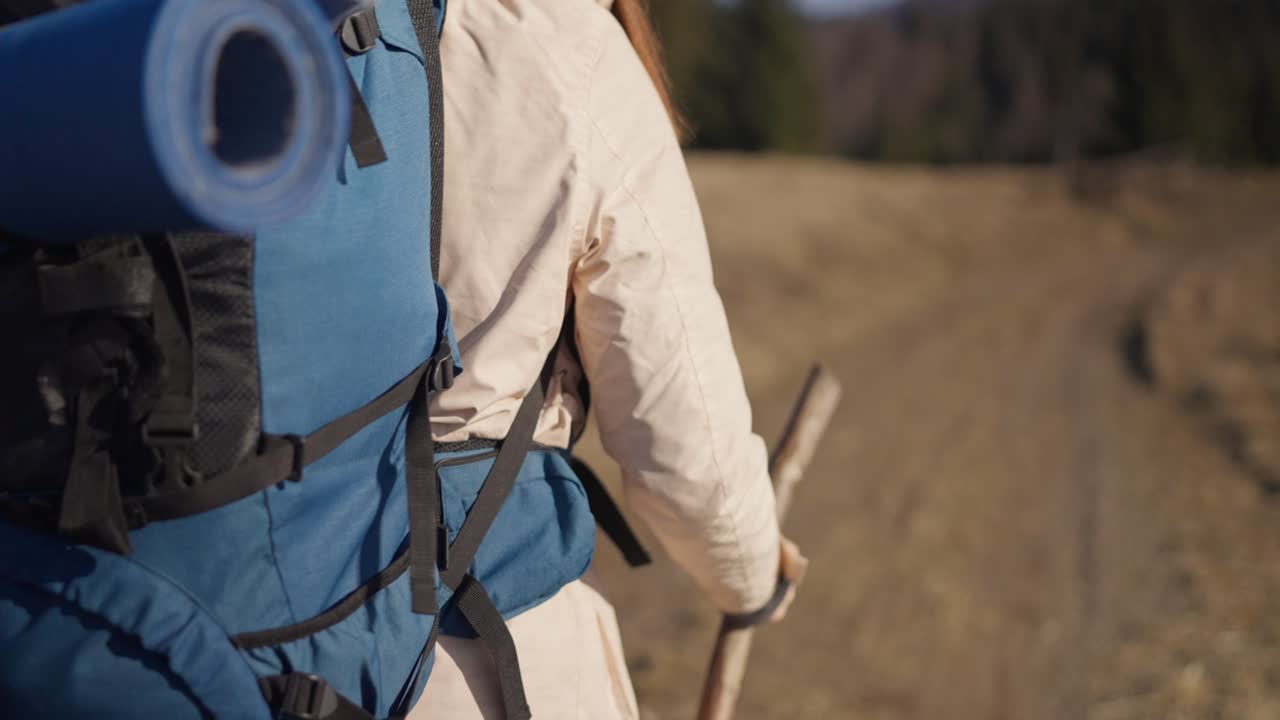 A person hiking in nature with a backpack
