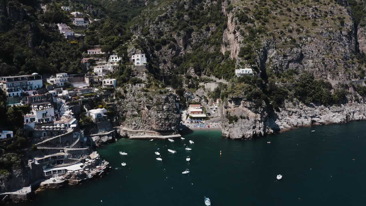 Wide drone shot of Praiano's steep coast in Italy