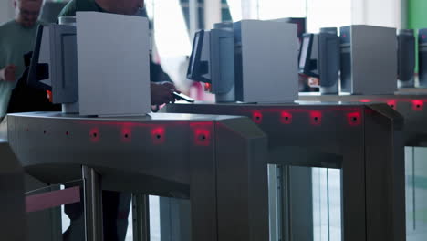 person using turnstile at an access point