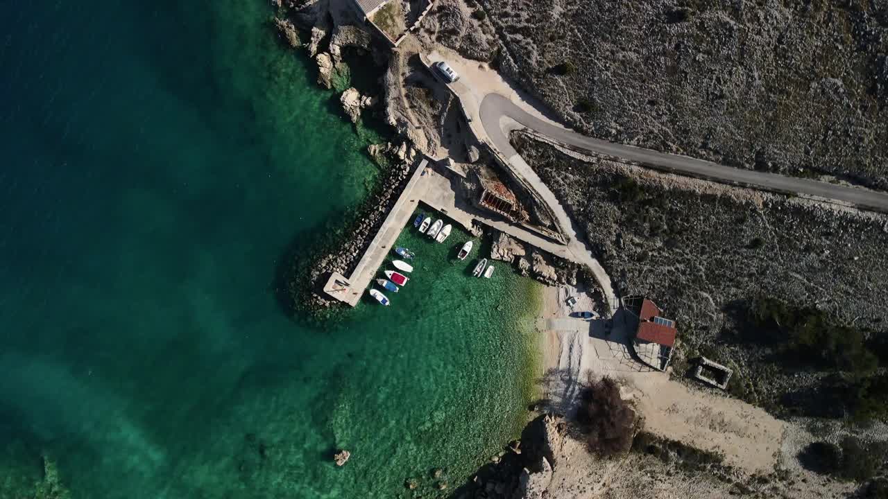 Down shot birds eye with drone in Luka Croatia coast clear sea and harbor with boats majestic view