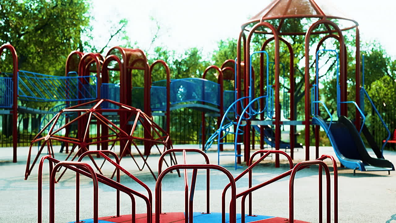 Empty swings on summer kids playground