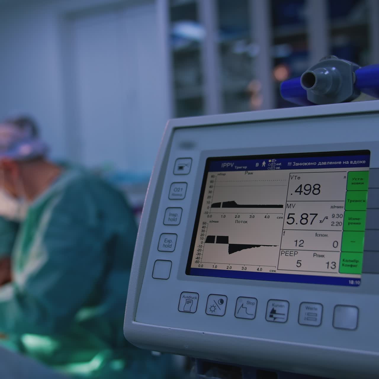 Medical monitor on blur background of surgical process. Modern medical equipment showing the patient's condition during plastic surgery in clinic