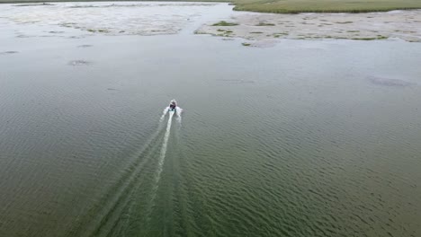 a boat crossing a lagoon