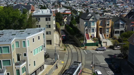 two light rails passing each other on the streets of san francisco,, usa - aerial view