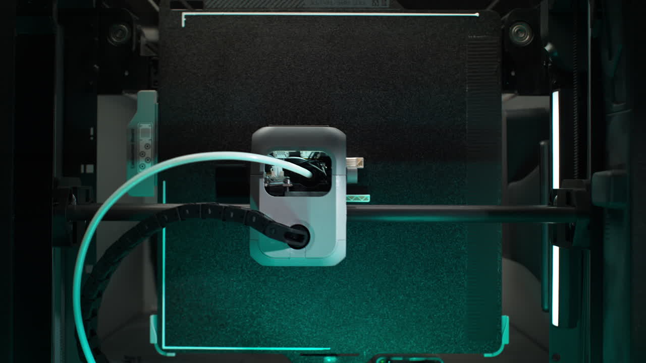 3D Printing Chamber Top View: the Extruder Mounted on a Rail Prints the Object with Filament Delivered through a Bowden Tube